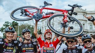 Sepp Kuss celebrates with his teammates after winning the 2023 Vuelta a España