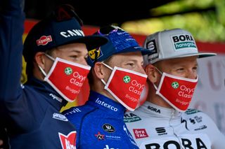 Riders wear face masks on the podium at the Oxyclean Brugge - De Panne