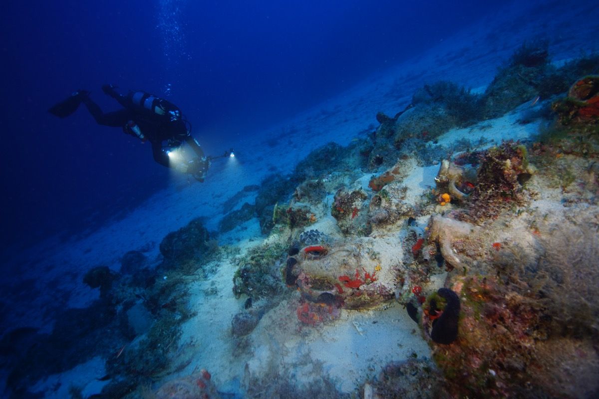 An archaeologist takes photos of a wreck site around Fourni, a cluster of Greek islands near Turkey in the eastern Aegean Sea.