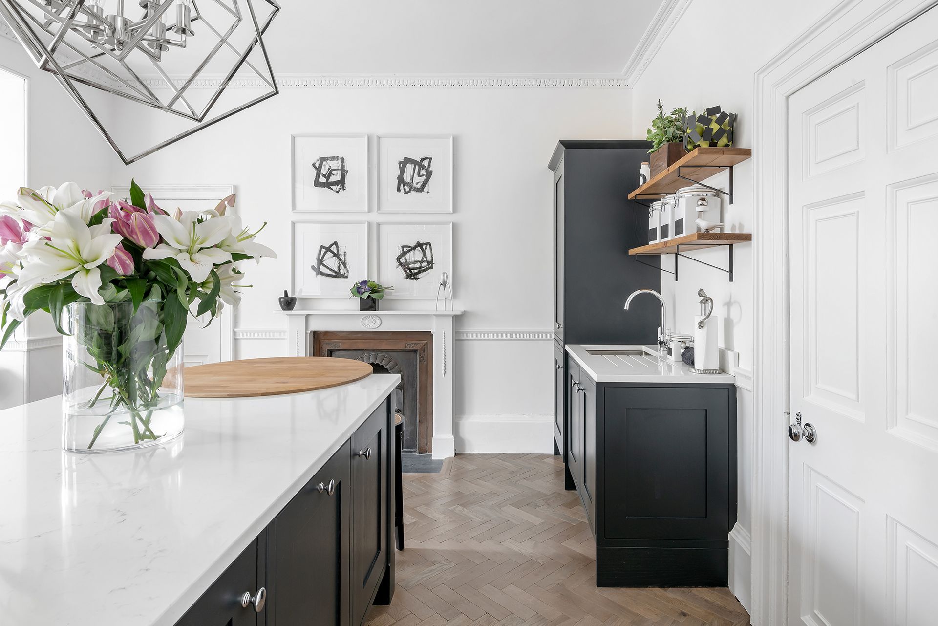 Black and white kitchen with abstract artwork