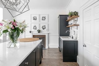 Black and white kitchen with abstract artwork