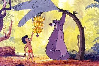 Cartoons of the 1960s; a bear holds down a banana tree so a small boy can pick the fruit