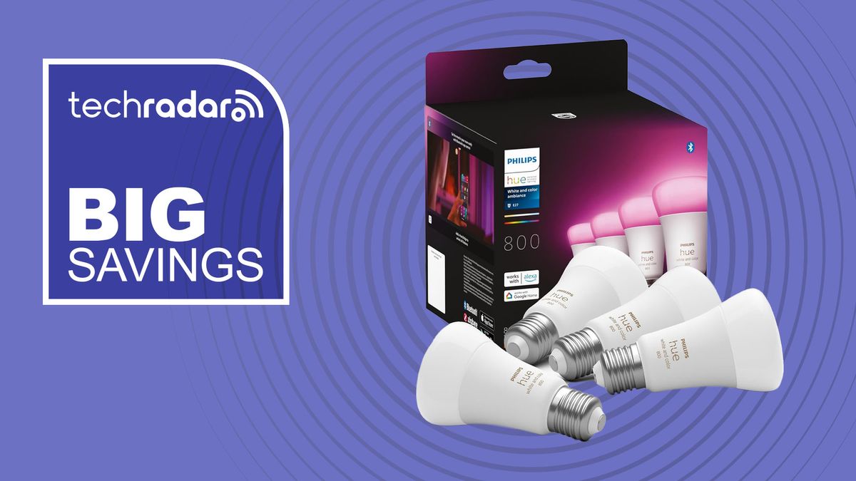 Pack of four Philips Hue light bulbs on purple background with white text reading &quot;TechRadar big savings&quot;