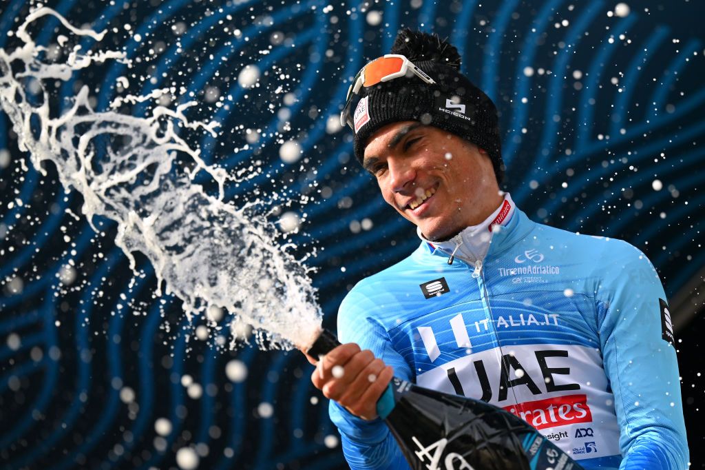 GUALDO TADINO ITALY MARCH 06 Juan Ayuso of Spain and UAE Emirates Team Blue Leader Jersey celebrates at podium during the 59th TirrenoAdriatico 2024 Stage 3 a 225km stage from Volterra to Gualdo Tadino 527m UCIWT on March 06 2024 in Gualdo Tadino Italy Photo by Tim de WaeleGetty Images
