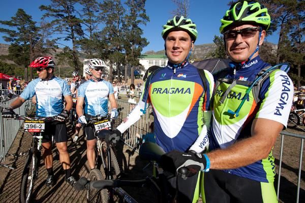 Heinrich Wagner (l) a blind entrant and Gerrie Olivier(r) prepare to start the prologue on their tandem