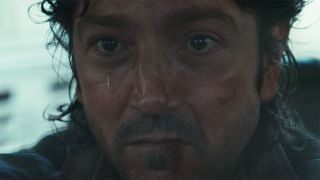 A close up of Cassian Andor crying in Andor season 2 episode 8