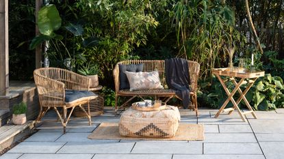 Black decking area covered with pergola