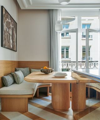 wooden kitchen banquette with striped floors and rounded shapes