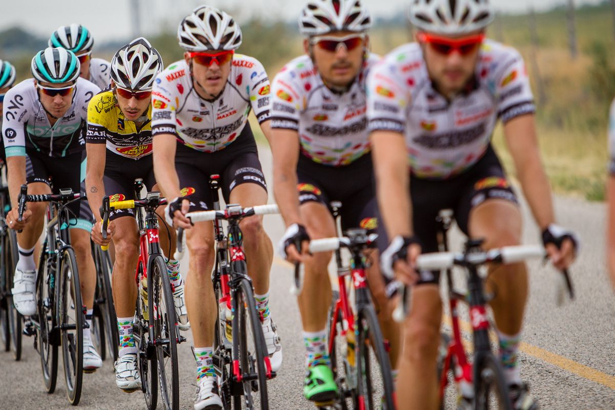 Lachlan Morton (Jelly Belly) stays tucked in behind teammates.