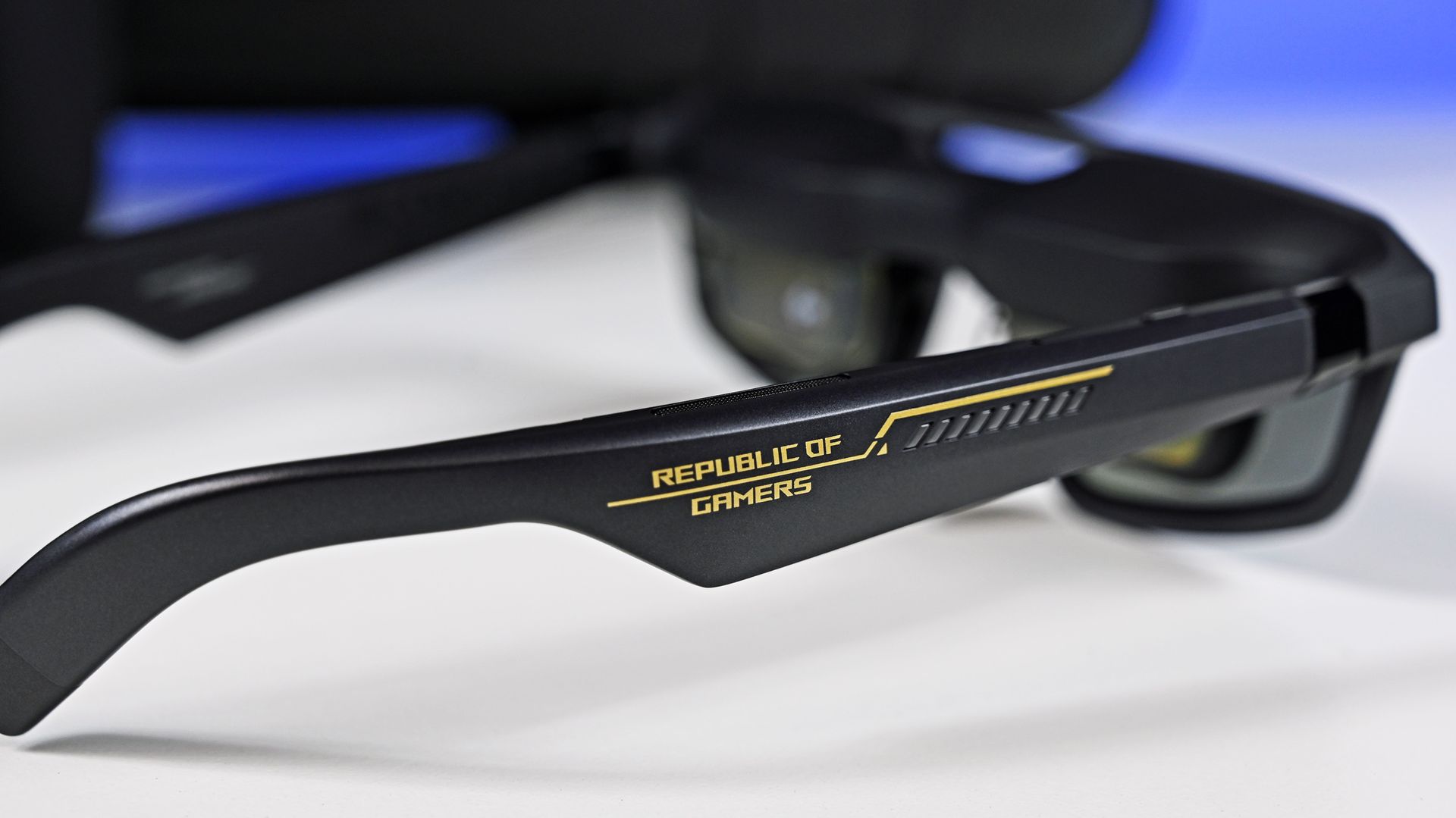 Side profile of the ROG XREAL AR glasses arm, featuring gold