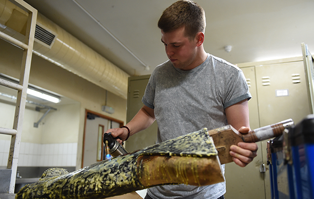 To prepare a new pair of boots, 2kg of beeswax is melted onto them using a blowtorch