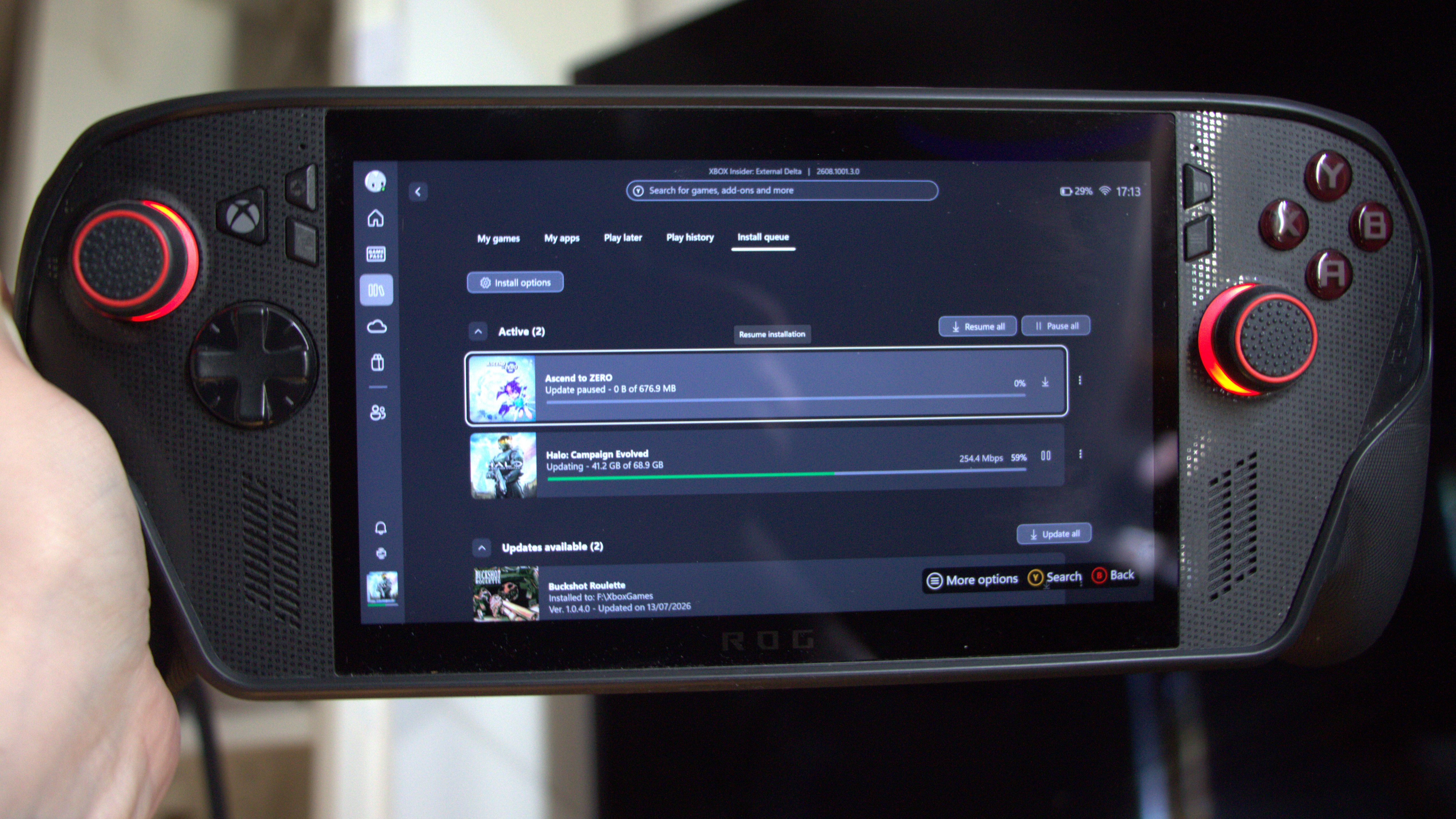 Xbox Ally X console with a download up on the screen