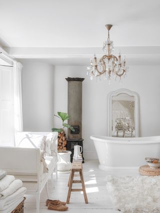 All white bathroom with freestanding bath