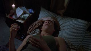 kevin bacon looking scared in bed in Friday the 13th