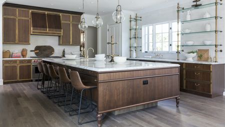 dark timber and brass kitchen with vast island