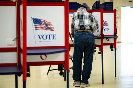 A voter casts their ballot at a polling station at the VFD Activities Building in Middletown, Maryland, US, on Tuesday, May 7, 2024