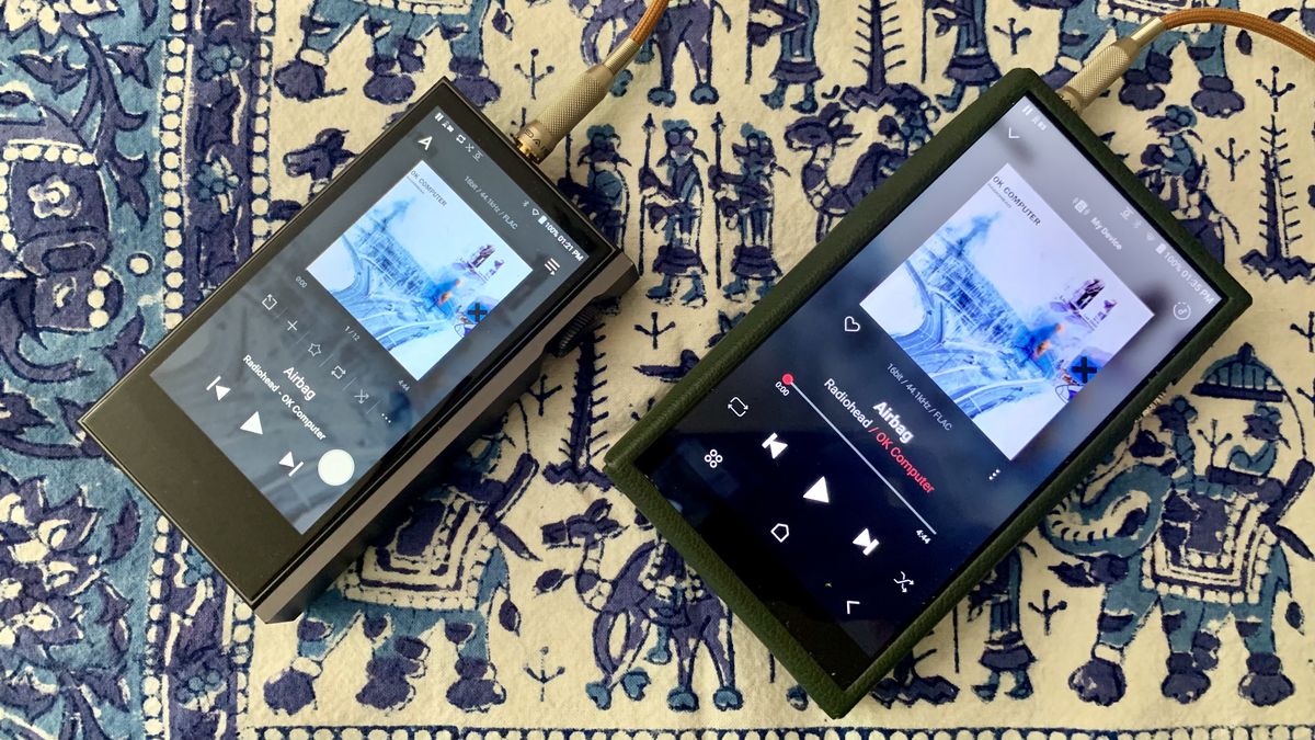 Astell &amp; Kern A&amp;ultima SP3000 and Astell &amp; Kern Kann Max side by side, showing Radiohead&#039;s OK Computer, on a blue and white tablecloth