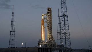 A view of NASA's Artemis 1 SLS moon rocket on the launch pad on June 12, 2022 at dawn.