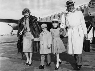Lucille Ball and her husband Desi Arnaz arrive at London Airport with their children Lucie and Desi Jr., 10th June 1959