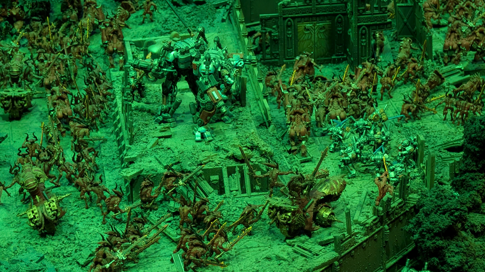 Grey Knights models battle against demons on a Warhammer 40,000 battlefield