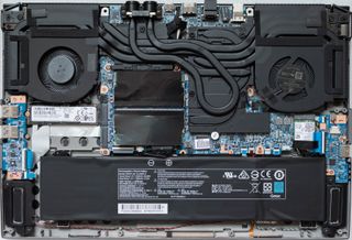 Inside of the XMG Neo 15 with pipes for liquid cooling.