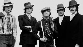 The Moody Blues, dressed as gangsters for photoshoot, 18th October 1967. From Left to Right. John Lodge, 25, Bass. Justin Hayward, 21, Lead Guitar & Singer. Graham Edge, 25, Drums. Mike Pinder, 25, Melophone. Ray Thomas, 26, Flute. (Photo by Sunday Mirror/Mirrorpix/Mirrorpix via Getty Images)