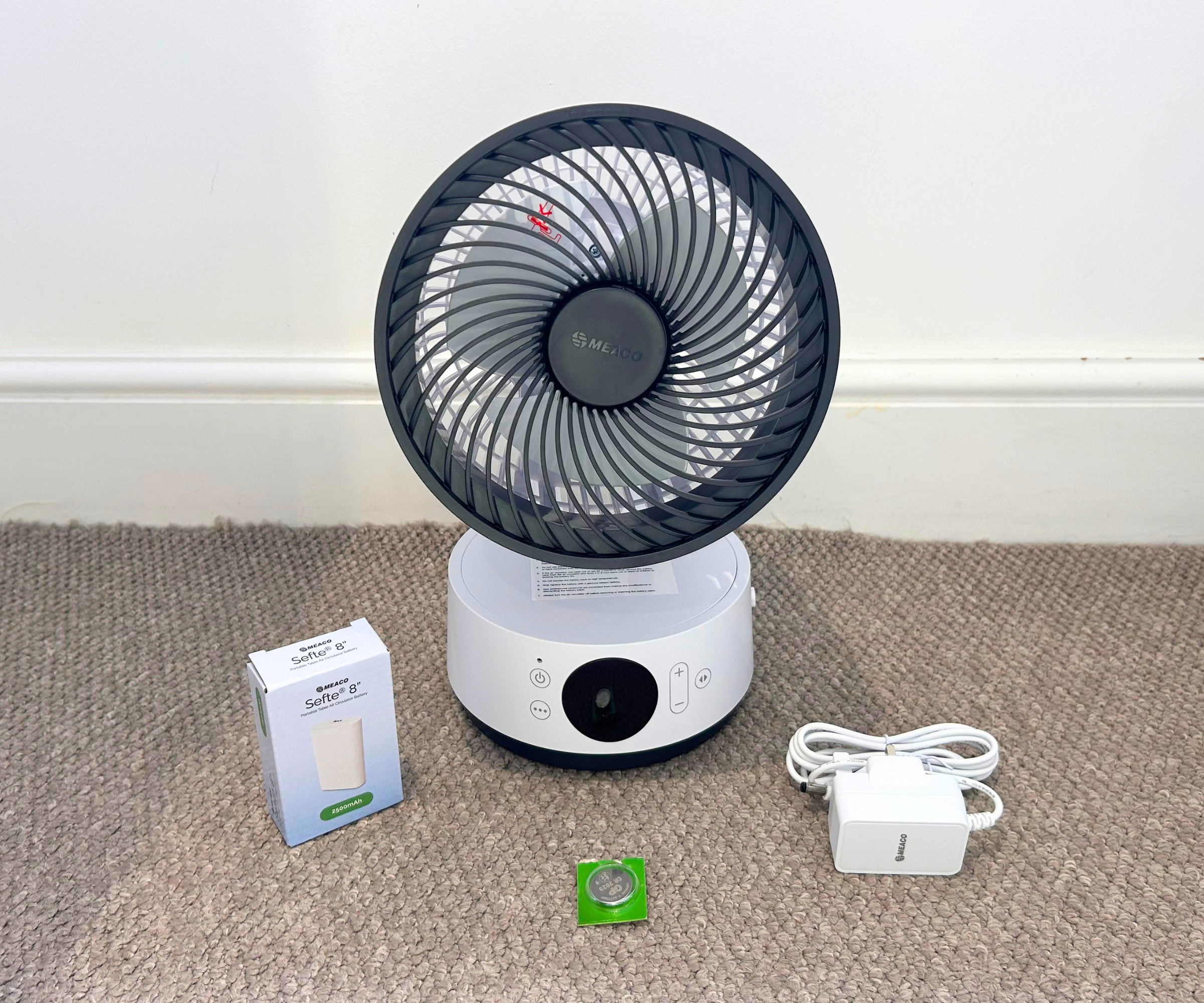 Meaco Sefte 6 with charging cable and batteries on grey carpet