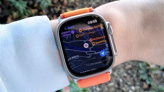 Apple Watch Ultra with map on woman&#039;s wrist