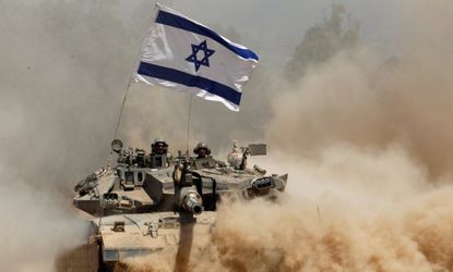An Israeli tank returns from Gaza