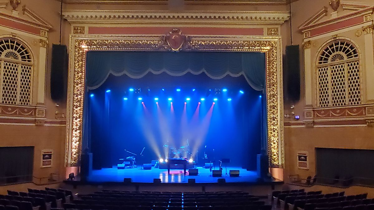 The Stadium Theatre alit in blue beams of light.