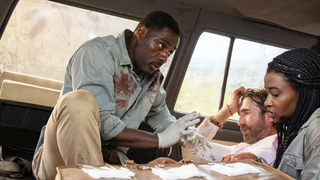 Idris Elba as Dr. Nate Daniels, panicked in a car in Beast