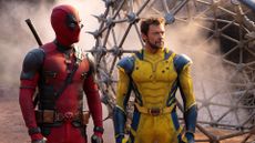A screenshot from Deadpool and Wolverine, one of the best Marvel movies, showing the two heroes looking at something off-screen