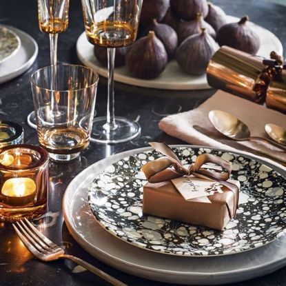 dining table with lsa edge white wine glass and royal stafford plate