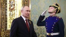 Russian President Vladimir Putin walks to post-Victory Day news conference