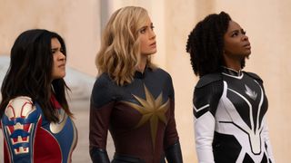 Kamala Khan, Carol Danvers, and Monica Rambeau stare up at something off-screen in The Marvels, the latest entry in our best Marvel movies guide