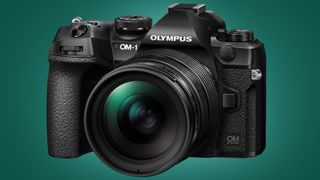 The Olympus OM-1 camera on a green background
