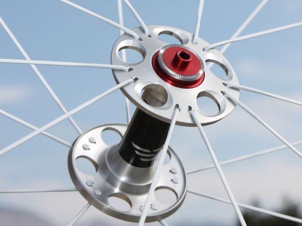 The FCC end caps are a full 25mm in diameter in comparison to a more common 19mm. Measured outside-to-outside, the hub flanges are a whopping 83mm apart.
