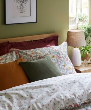 floral cottagecore style bed with pillows