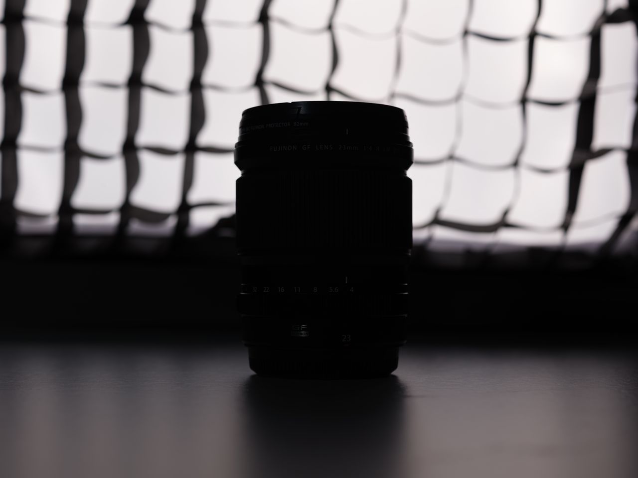 A photo of a Fujifilm lens backlit with a softbox
