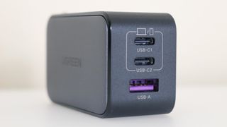 The two USB-C ports and the USB-A port on the front of the UGREEN Nexode 65W Charger