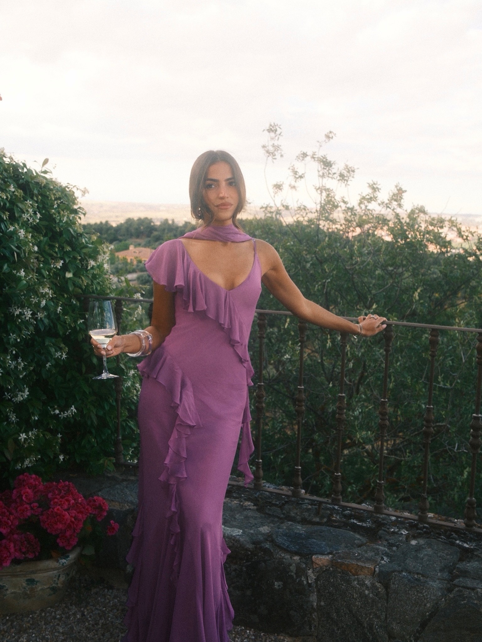 woman in purple ruffle gown