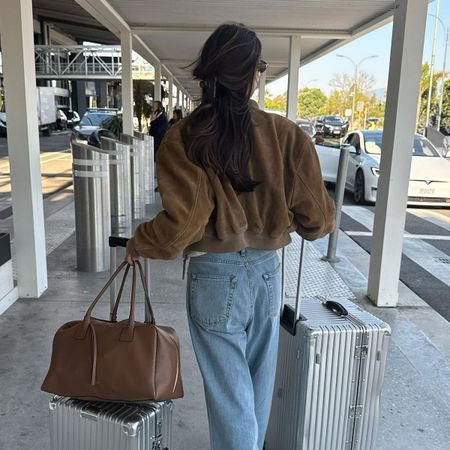 woman wearing chic airport outfit 2025
