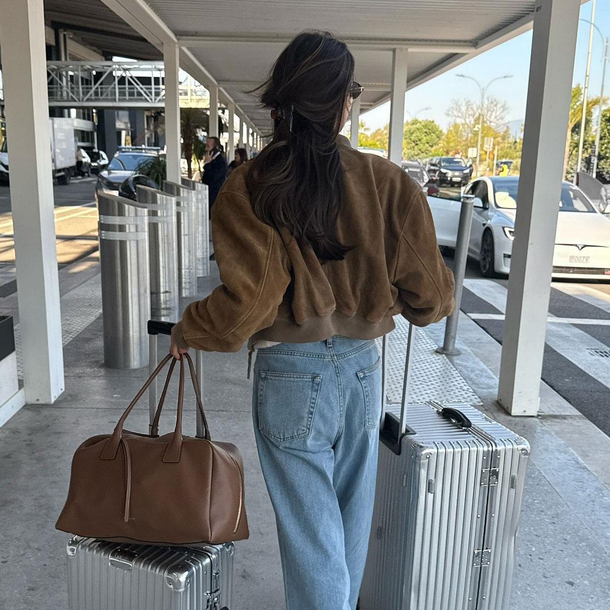woman wearing chic airport outfit 2025