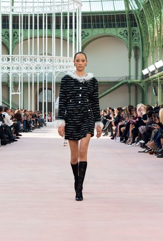 A model walking in the spring summer 2025 Chanel show at the Grand Palais during Paris Fashion Week.