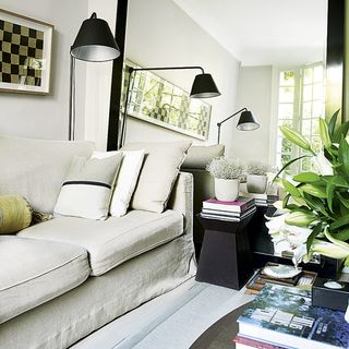 living room with white sofa and lamps