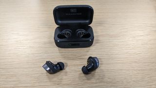 sennheiser momentum true wireless 4 with buds and case on display