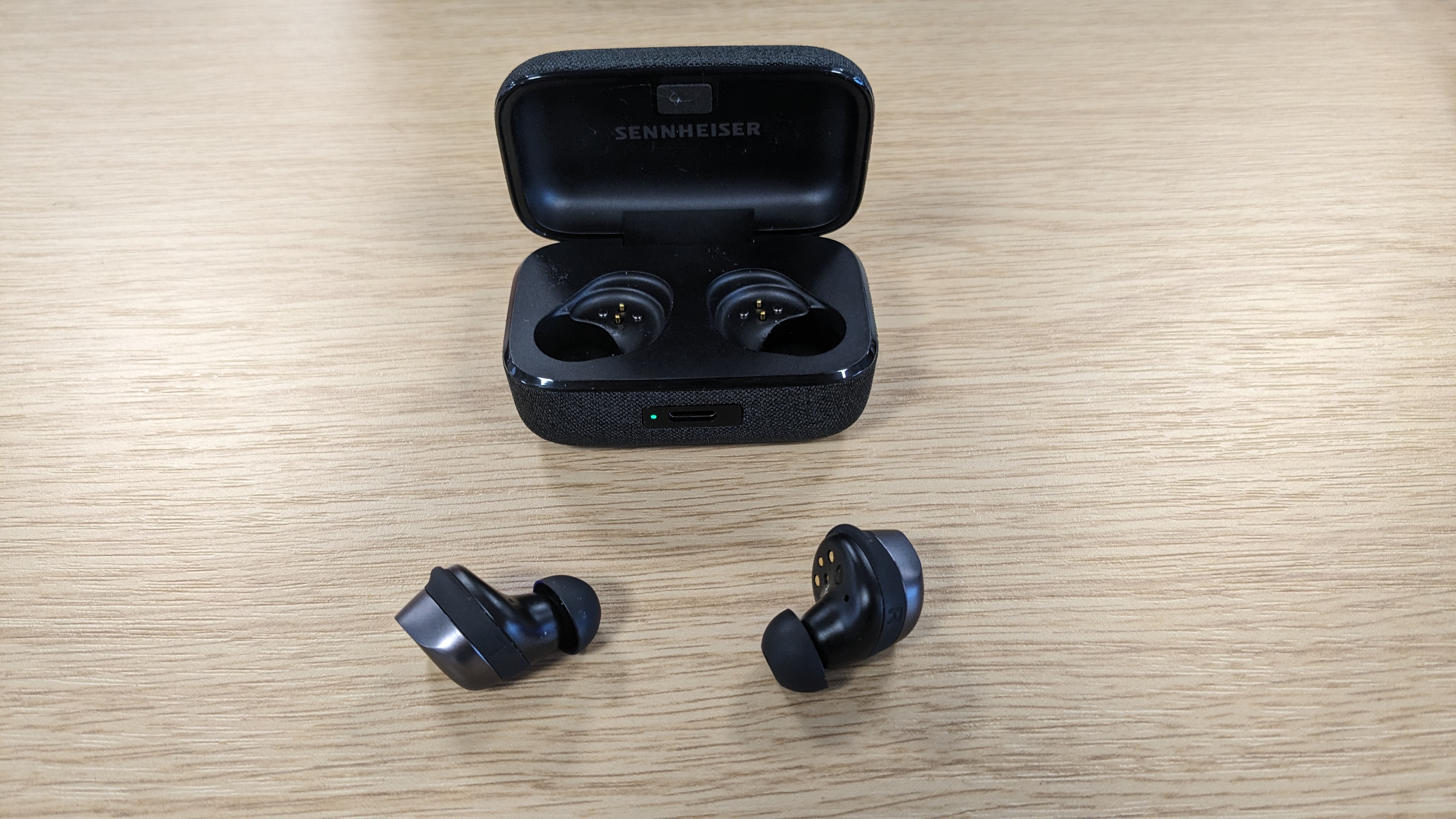 sennheiser momentum true wireless 4 with buds and case on display