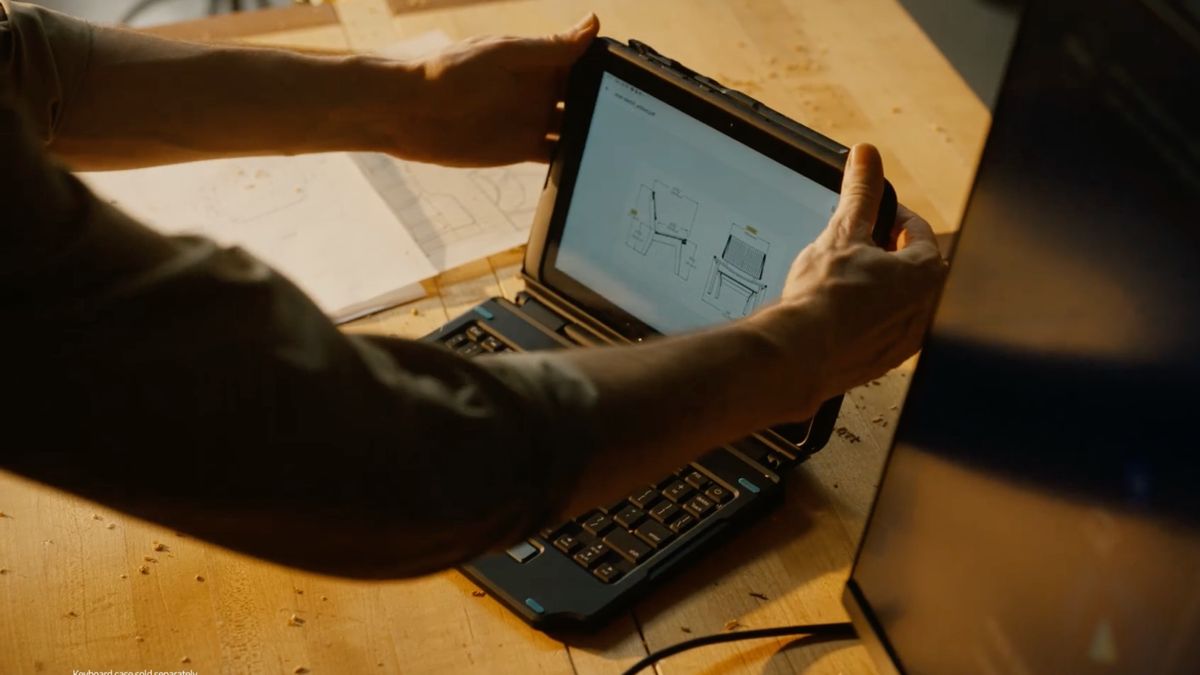 The Samsung Galaxy Tab Active4 Pro sitting on a connected keyboard in a workplace