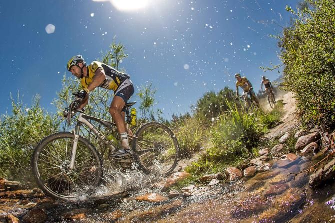 Karl Platt makes his way through a rocky river crossing