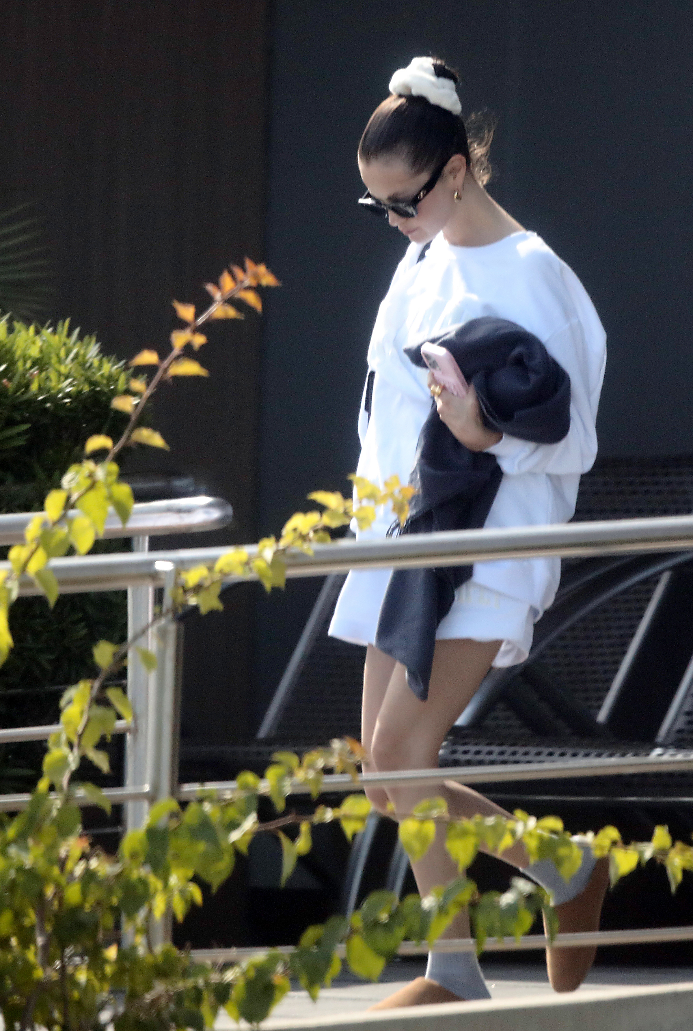 Selena Gomez styled tennis whites with Ugg slippers